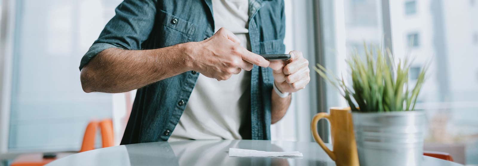 Man using a smartphone to make a mobile deposit